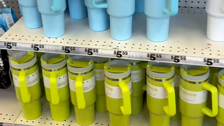 Green blue, and white tumblers on the shelves at Five Below