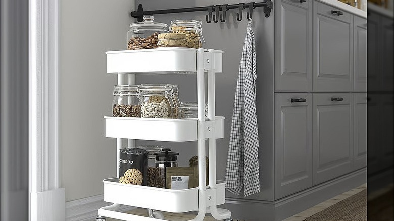 White IKEA cart filled with spices and jarred nuts