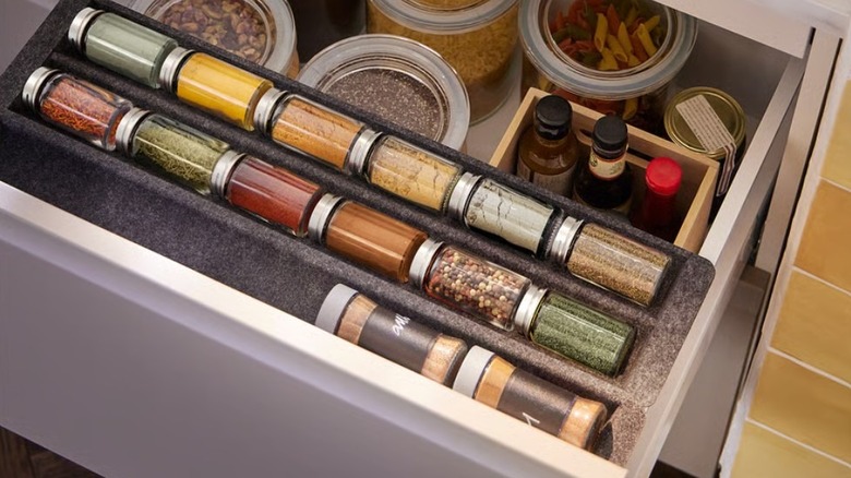 IKEA felt drawer organizer holding spices in a drawer