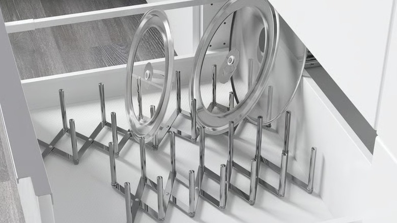 IKEA stainless steel pot lid organizer in bottom kitchen drawer
