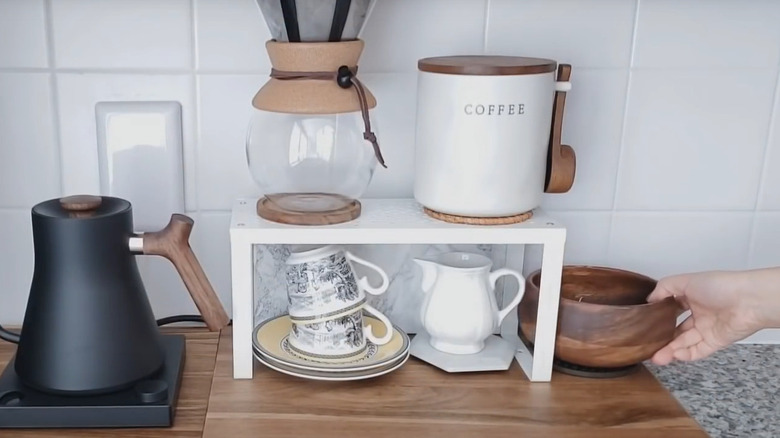 IKEA white shelf insert used as a countertop coffee setup