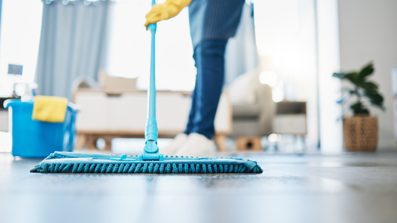 person mopping floor