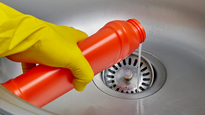 pouring drain cleaner into sink