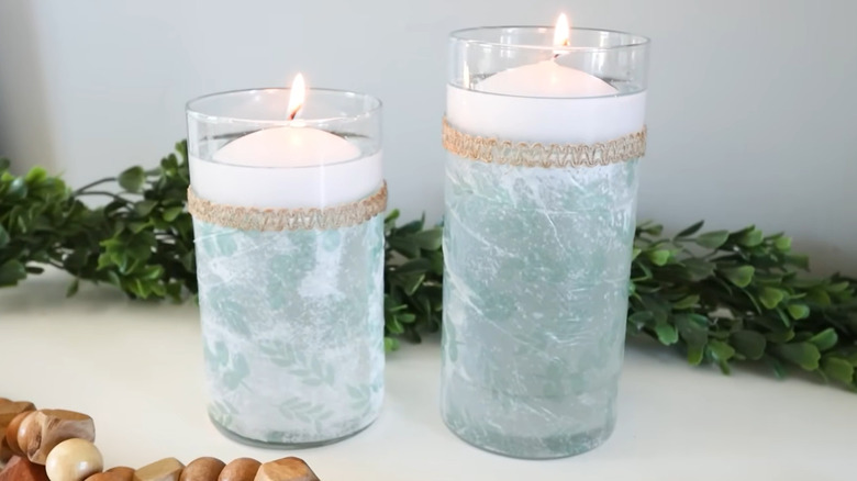Elegant DIY candles made from dollar store materials and vases with garland