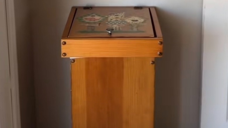 Tall wooden vintage trash can container