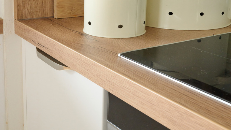 White countertop metal canisters in kitchen