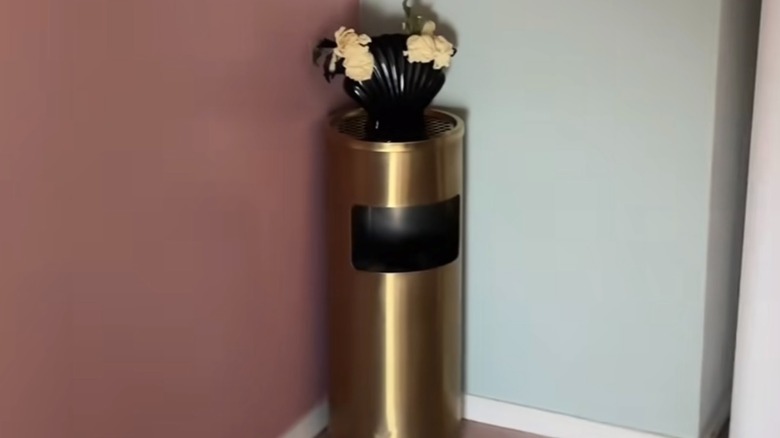 Round vintage brass commercial trash can refurbished for a home