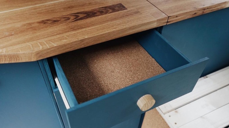 Kitchen or workbench drawer with a cork liner
