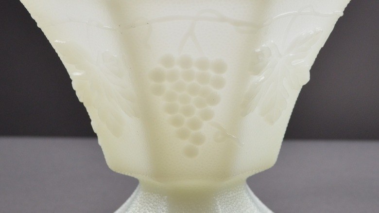 Close-up of yellowing Anchor Hocking milk glass candy jar