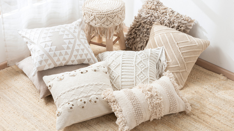 Pillows displayed with a small stool
