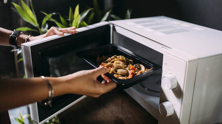Food going into a microwave