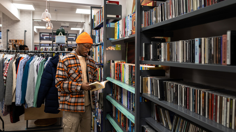 person browsing books in the thrift store