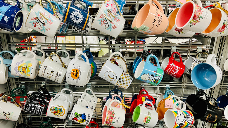 wall of coffee mugs at thrift store