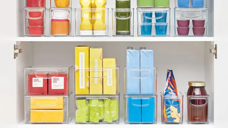 The storage bins from Costco in a pantry.
