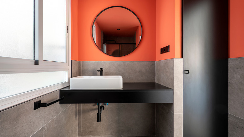 Modern bathroom with black countertop