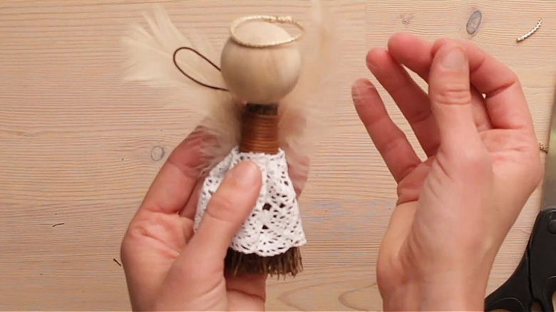 Angel made out of a cinnamon broom with a lace dress