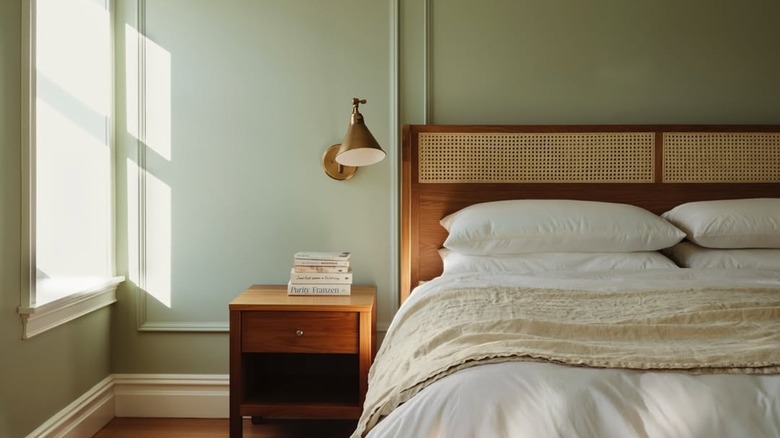 A bohemian bedroom painted Grecian green.