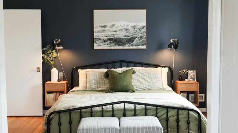 A minimalist bedroom painted Hale Navy blue.