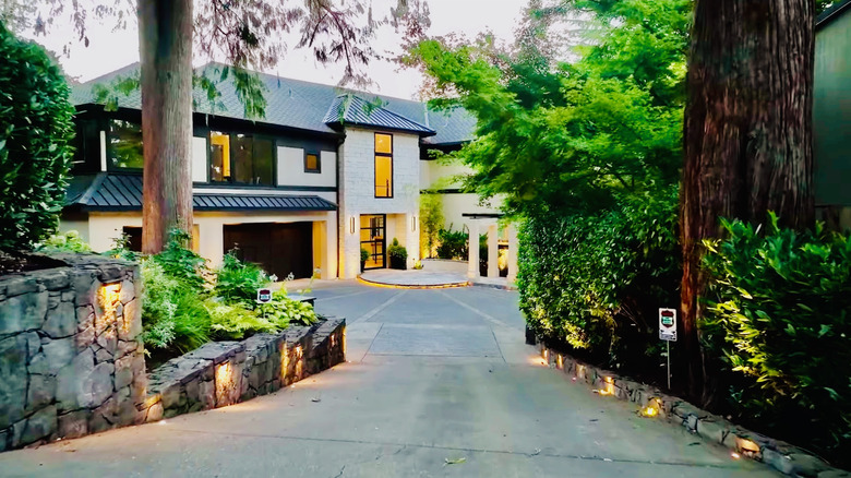 Lights line the driveway of this home.