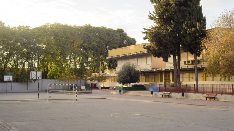 exterior image of school with basketball courts