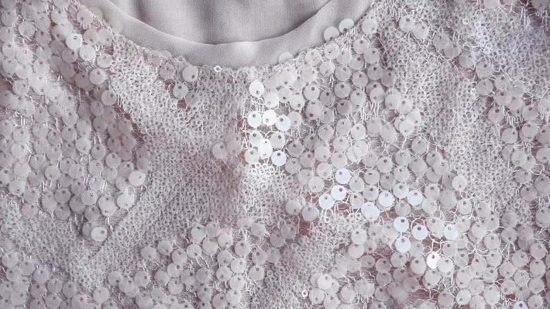 Pink shirt with sequins on it