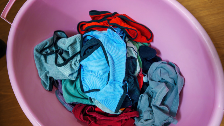 Underwear in a pink laundry basket