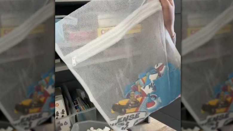 Puzzle pieces in a mesh laundry bag