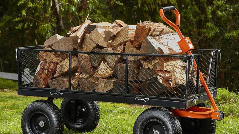 Harbor Freight's 1200 pound Capacity Steel Utility Cart loaded up with logs