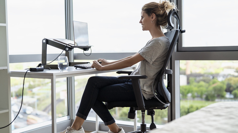 Picture of a woman sitting in an office chair at home