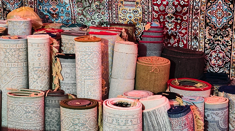A selection of rugs rolled up