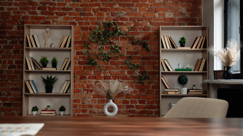 Two office bookshelves with keepsakes and books