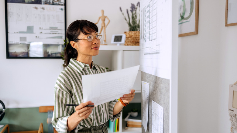 A person looking at a whiteboard