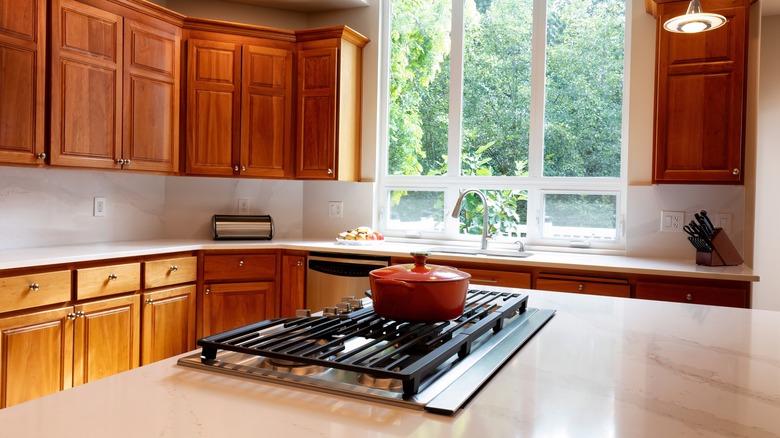 A kitchen island with a stovetop range