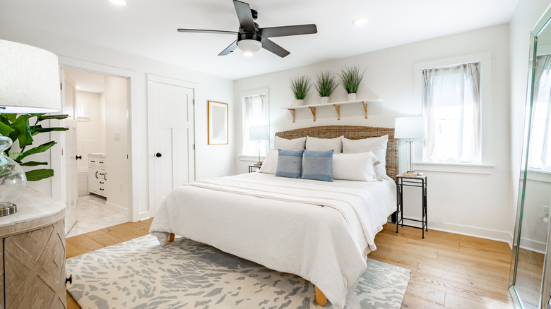 A bedroom with coastal decor