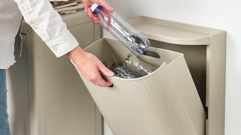 open wall-mounted GÅRDSBUTIK Bin filled with plastic bottles