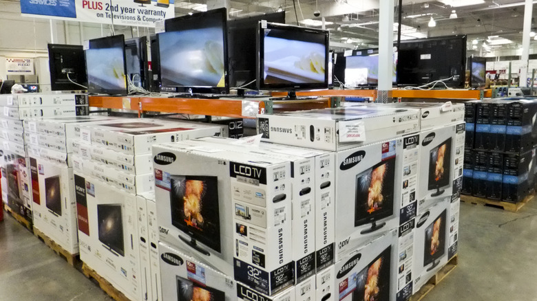 a display stack of large screen TV's at COSTCO