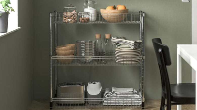 IKEA OMAR shelving unit with baskets filled with kitchen goods