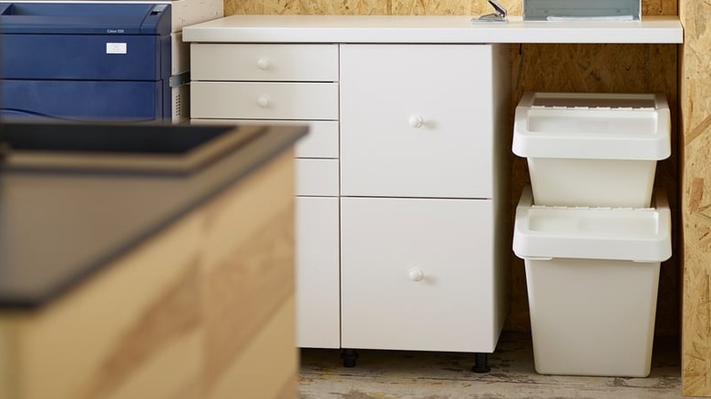 Two IKEA SORTERA Recycling Bins stacked under a desk