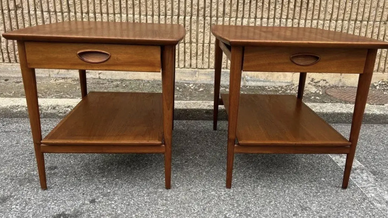 A paif of mid-century modern nightstands designed by Drexel Furniture
