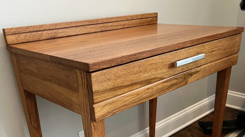 A mid-century modern desk designed by Raymond Loewy for Megel