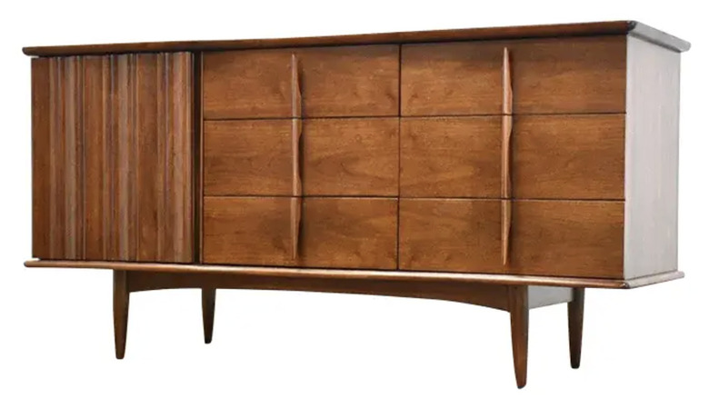 A walnut-finished mid-century modern-designed dresser from United Furniture