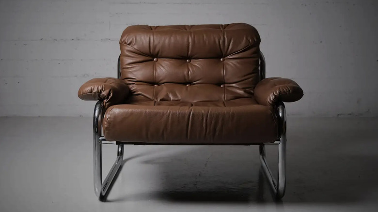A brown leather lounge chair designed by John Bertil Häggström for IKEA in the 1970s