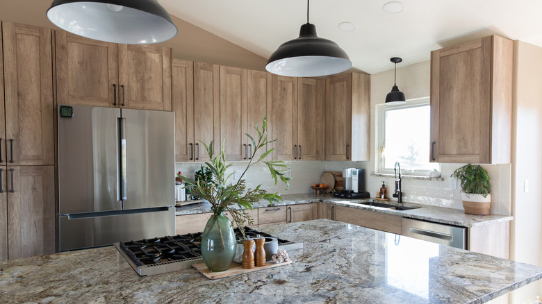 Beautiful marble countertops in a kitchen with wood cabinets