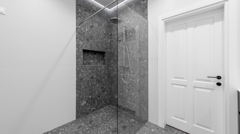 Modern curbless shower with gray tiles