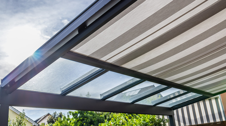 Close-up of a pergola roof with shades