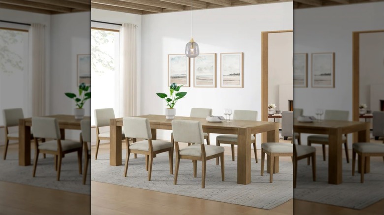 Costco dining set of table and chairs set up in a dining room.