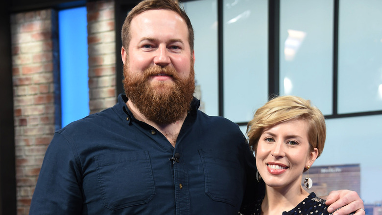 Erin and Ben Napier smiling on a TV show set
