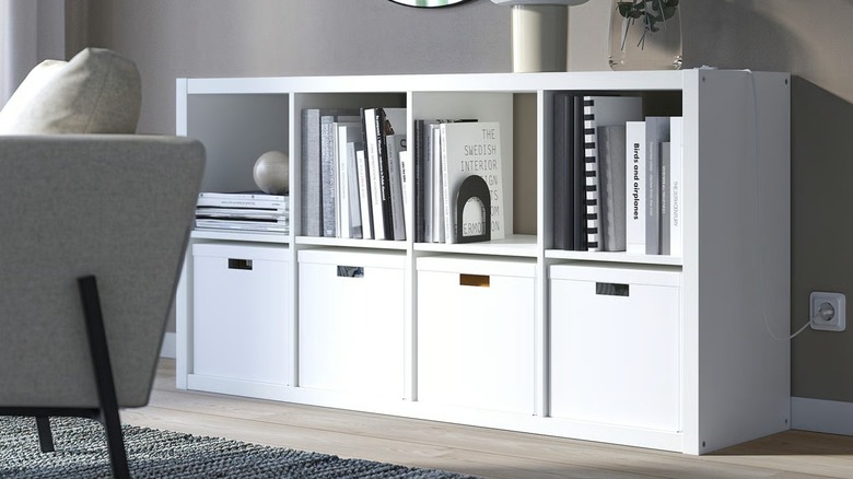 IKEA KALLAX shelf unit with boxes and books