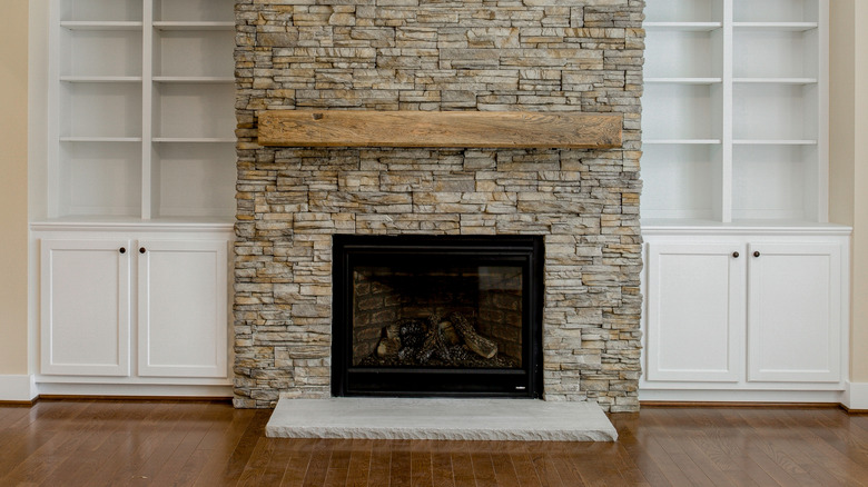 Living room with built-ins on either side of the fireplace