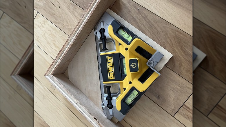 DeWalt square on wood surface against plywood pieces